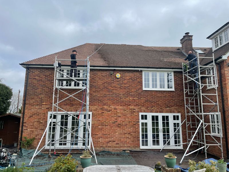 Roof cleaning carried out safely from scaffold towers by The Roof Moss Cleaners in Hurstpierpoint